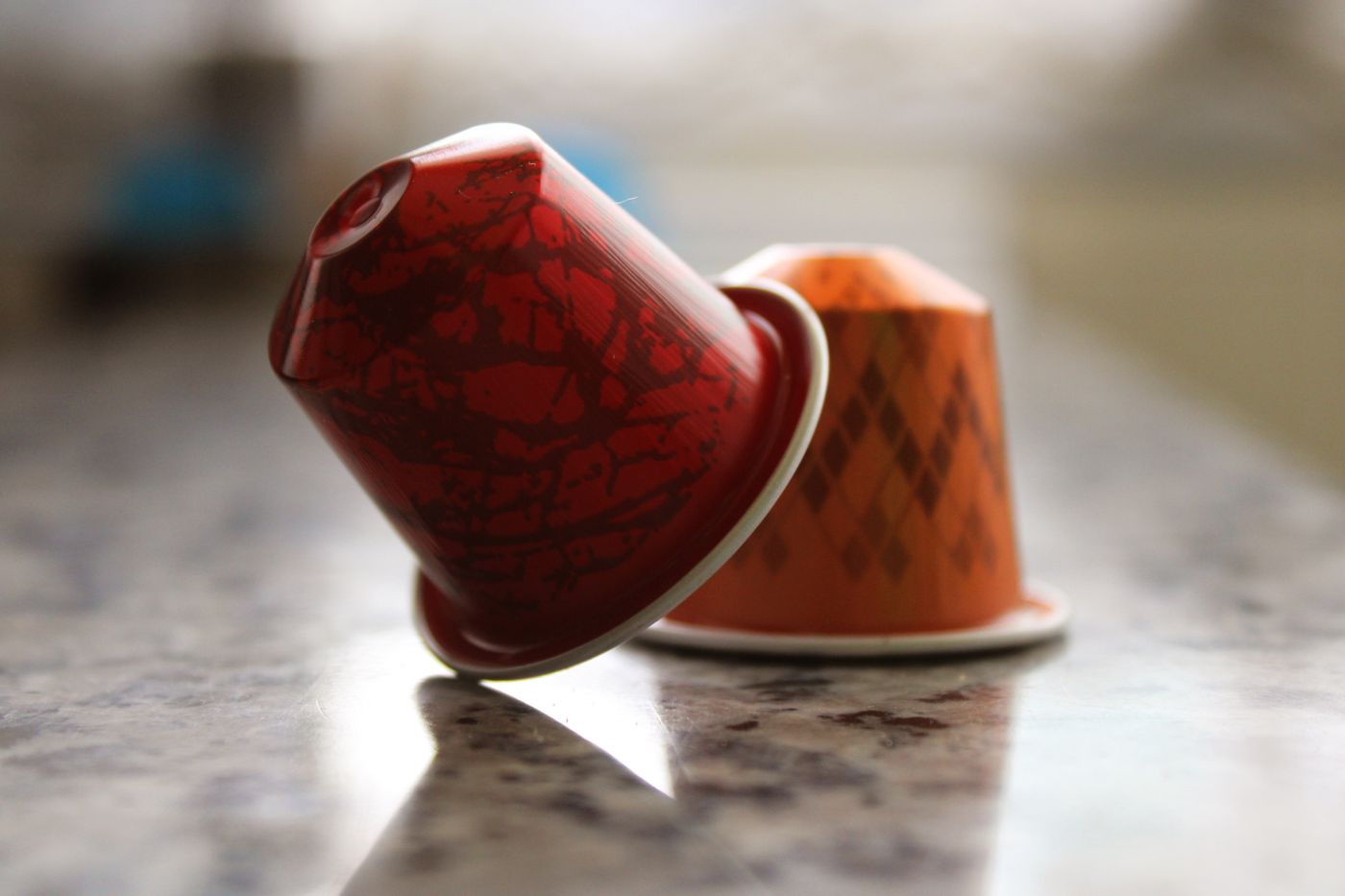 Two single-serve coffee capsules